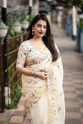 Cream pure linen saree with ethnic pencil stitch embroidery and matching embroidered phantom silk blouse.