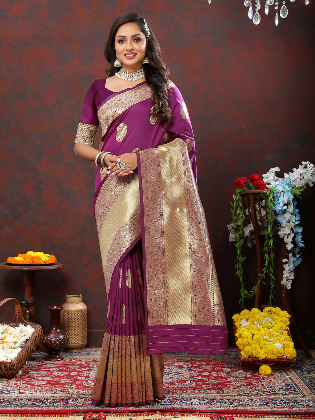 Wine-colored soft silk saree featuring gold zari weaving patterns