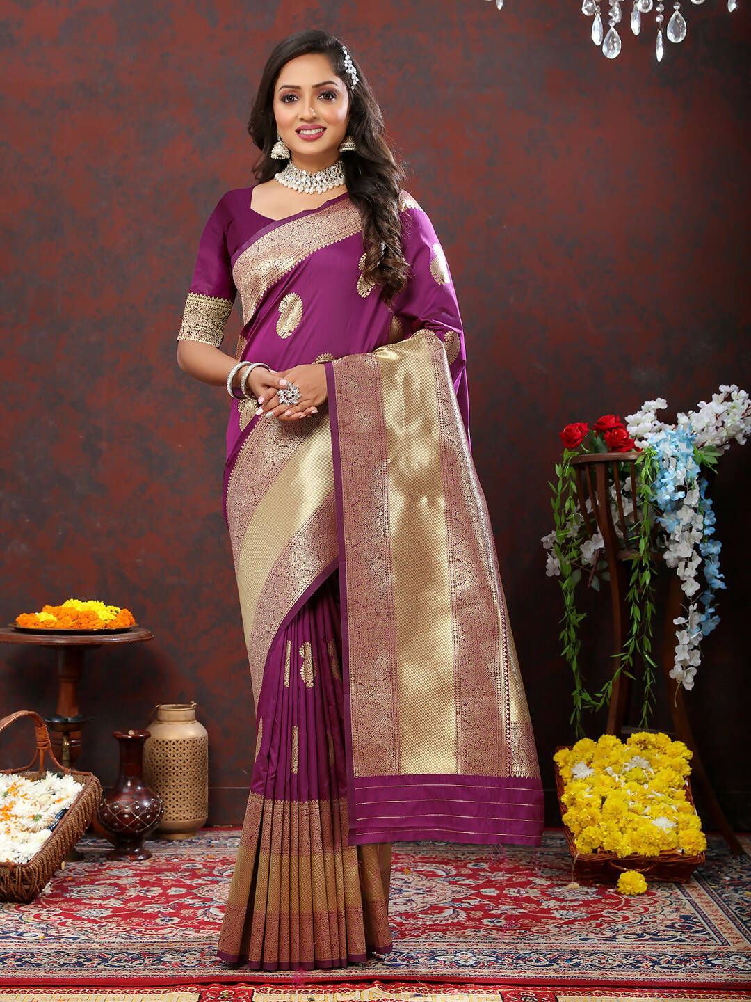 Wine-colored soft silk saree featuring gold zari weaving patterns