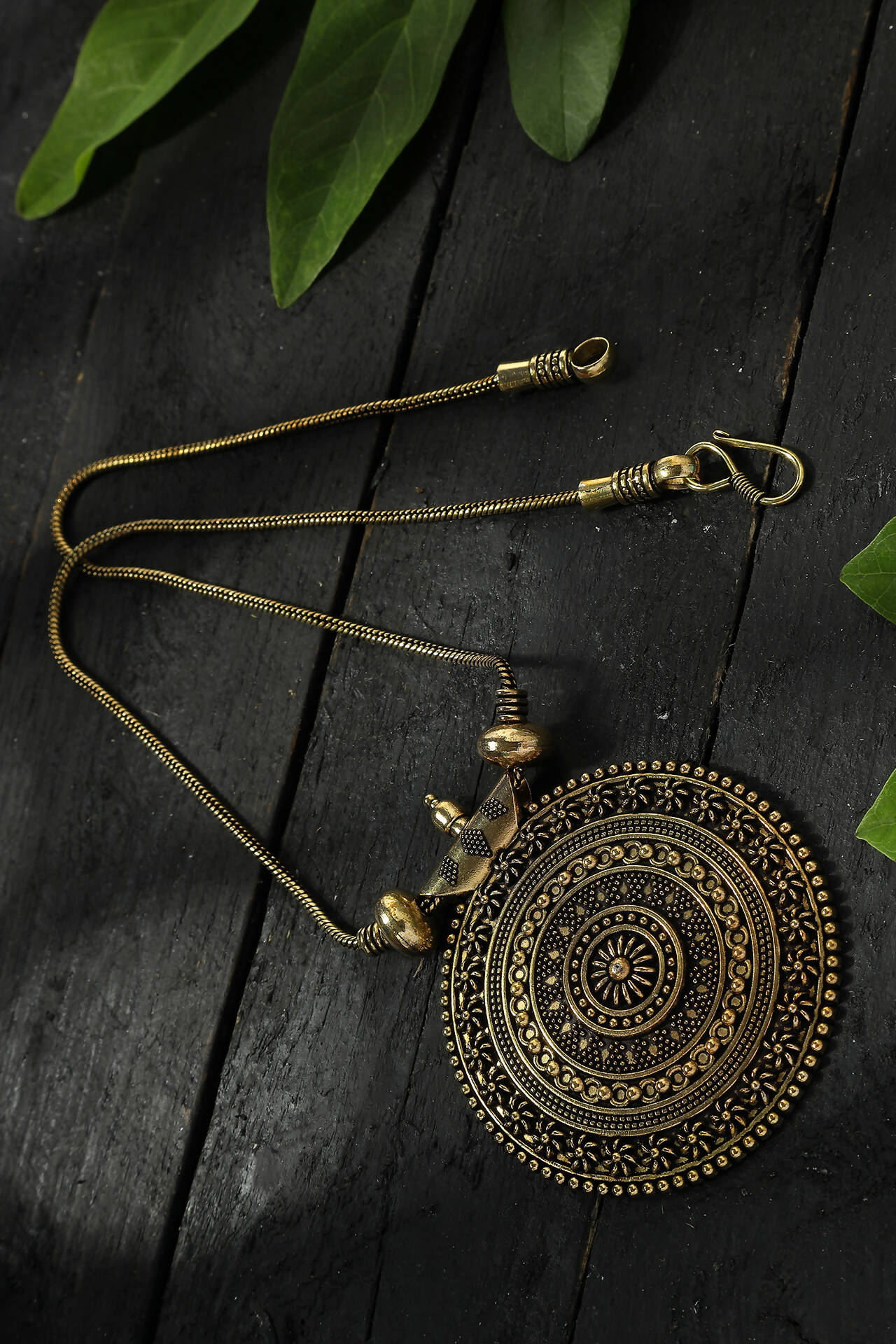 A beautiful gold-polished oxidised long chain with a detailed pendant for women.