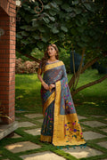 Morpich colored Paithani silk saree with intricate Zari woven floral design and matching blouse piece