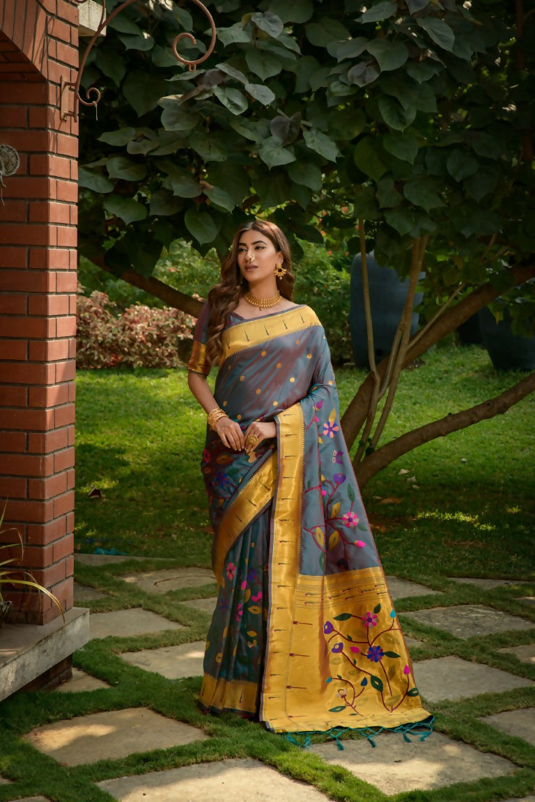 Morpich colored Paithani silk saree with intricate Zari woven floral design and matching blouse piece