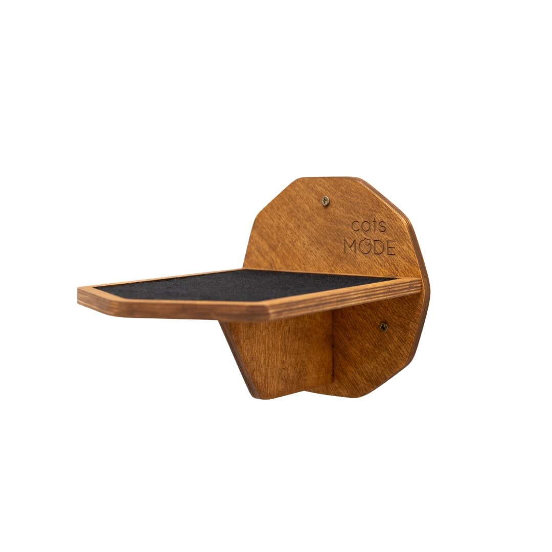 Modern oak hexagon cat wall step with black felt inlay mounted on a living room wall
