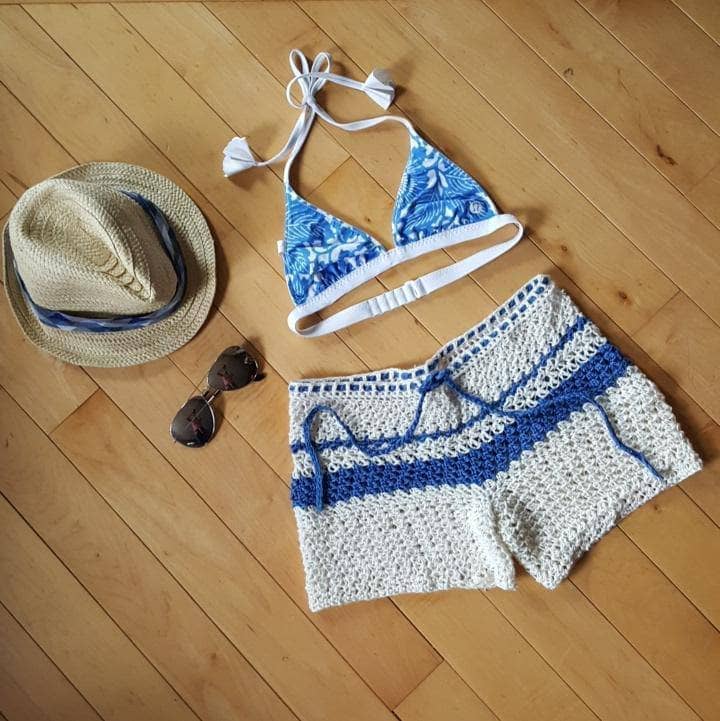 Close up of Oasis Crochet Summer Shorts in white and royal blue featuring a relaxed fit and nautical aesthetic.