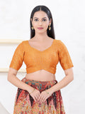 Orange tissue fabric blouse with a sweetheart neckline and elbow-length sleeves.