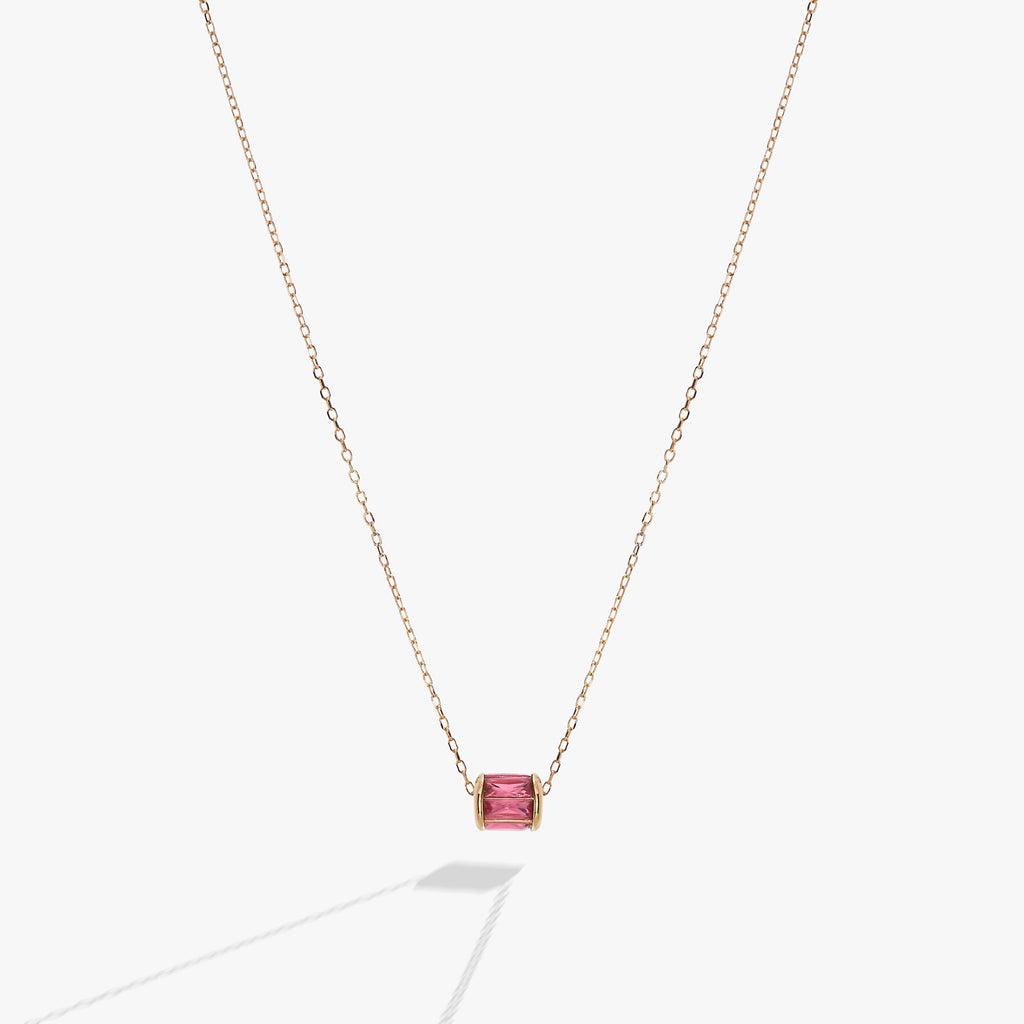 October birthstone pendant necklace with blush baguette crystals in a barrel design