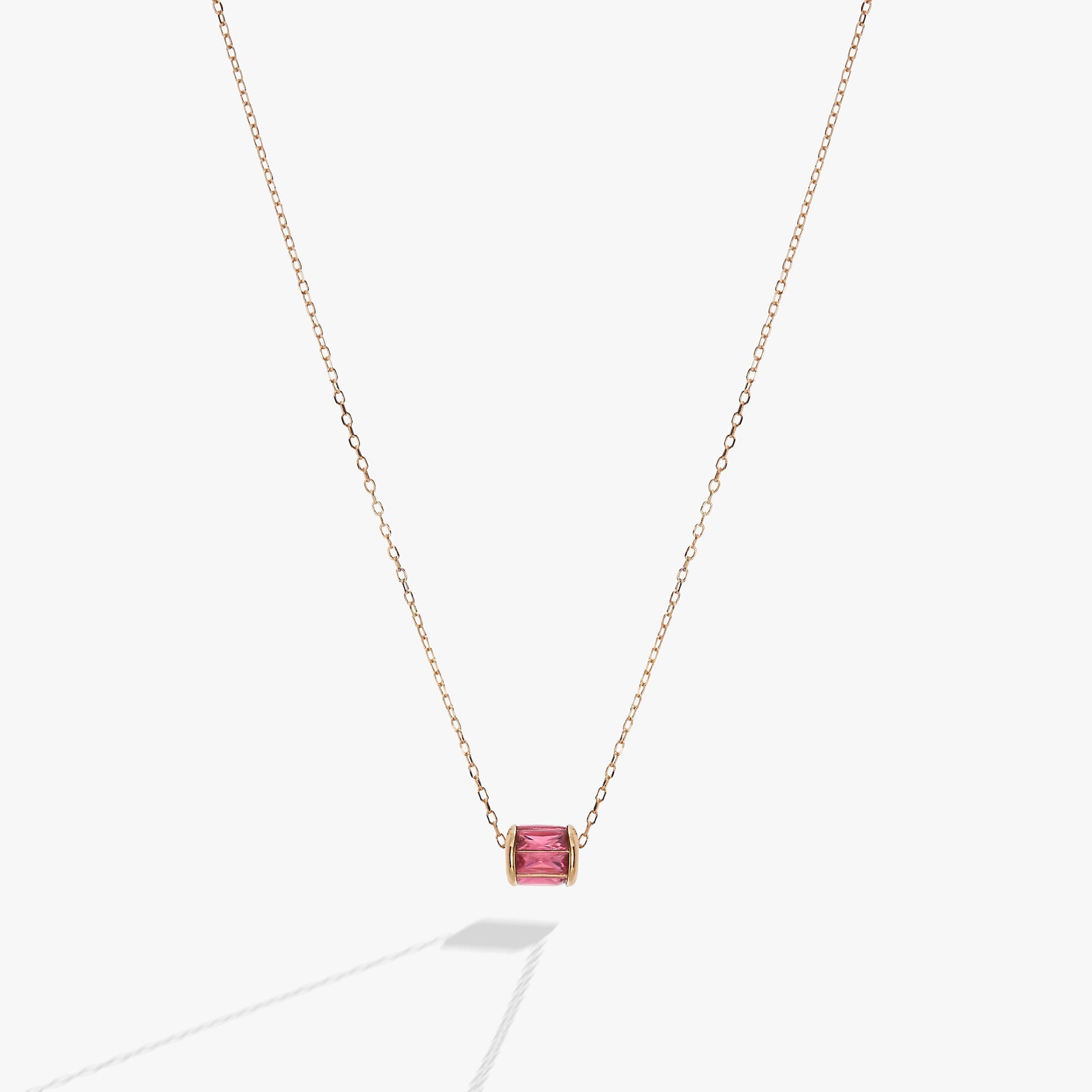 October birthstone pendant necklace with blush baguette crystals in a barrel design