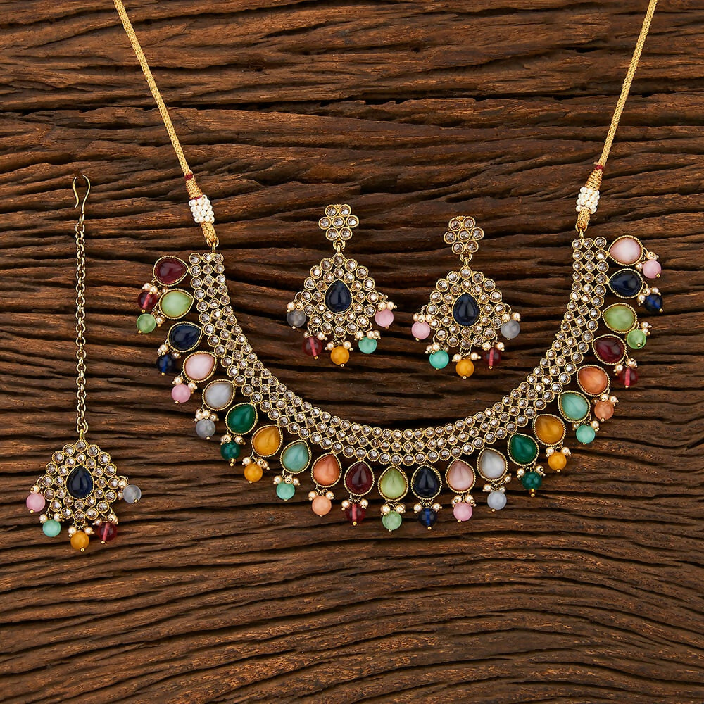 Multi-style Polki and pearl necklace set with golden finish and matching earrings