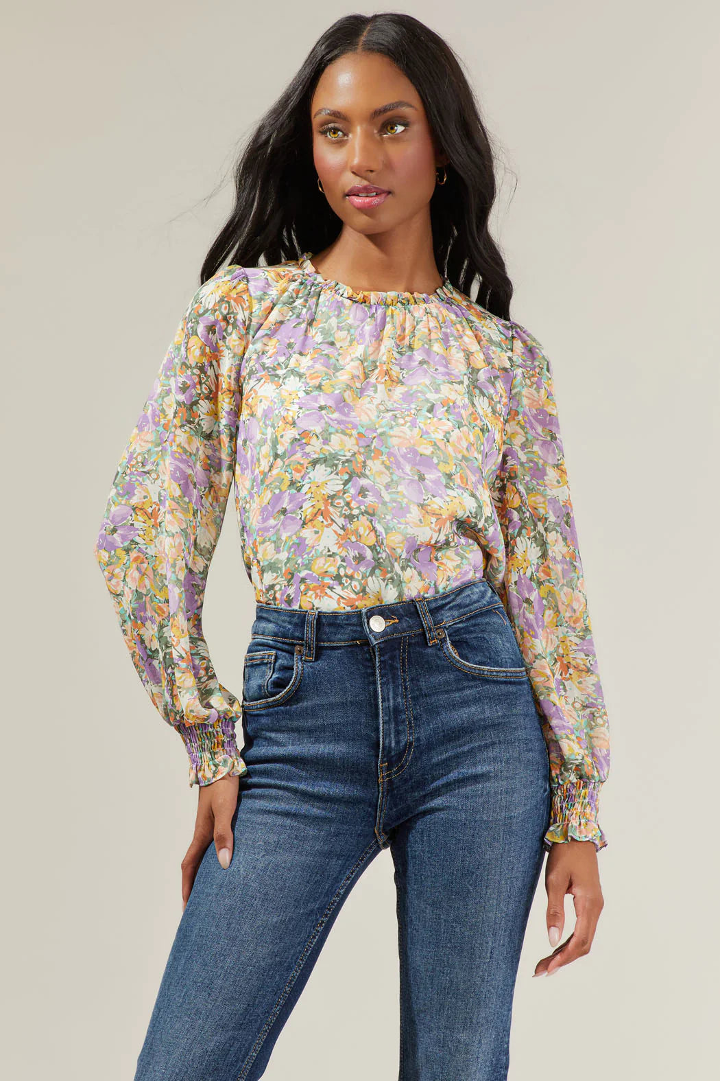 Liane Floral Long Sleeve Blouse featuring poet sleeves, ruffle neck detail, and smocked cuffs in a relaxed fit.