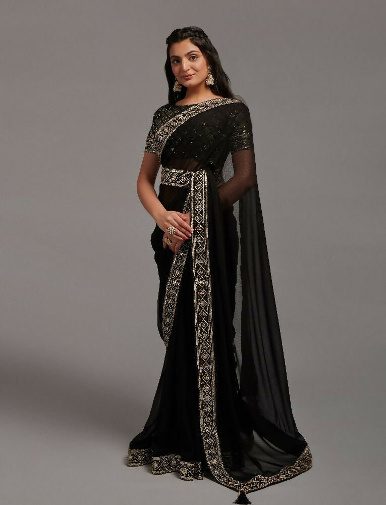 Chic black Zometo saree with intricate embroidery and lace border