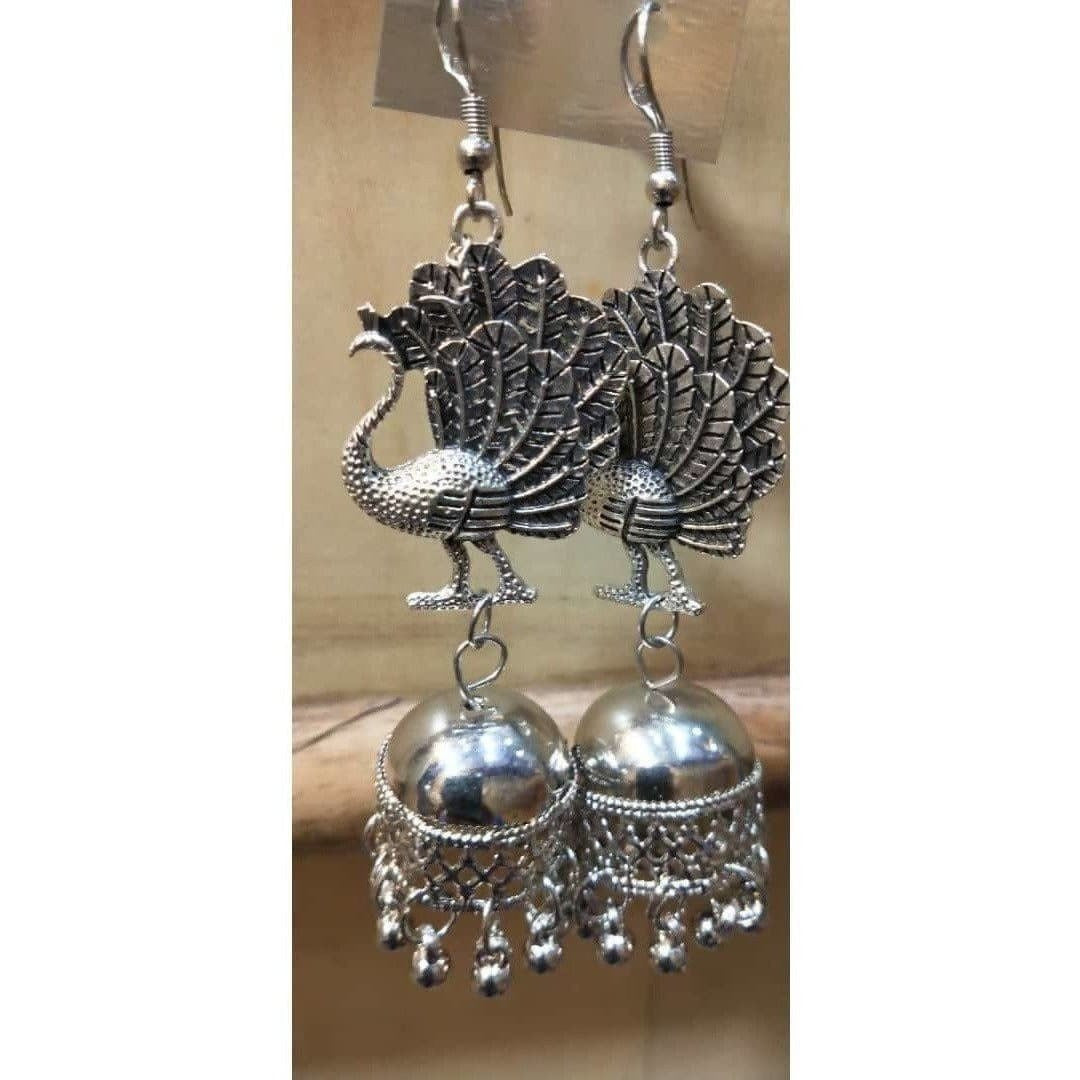 Traditional oxidized silver peacock design jhumka earrings for women.