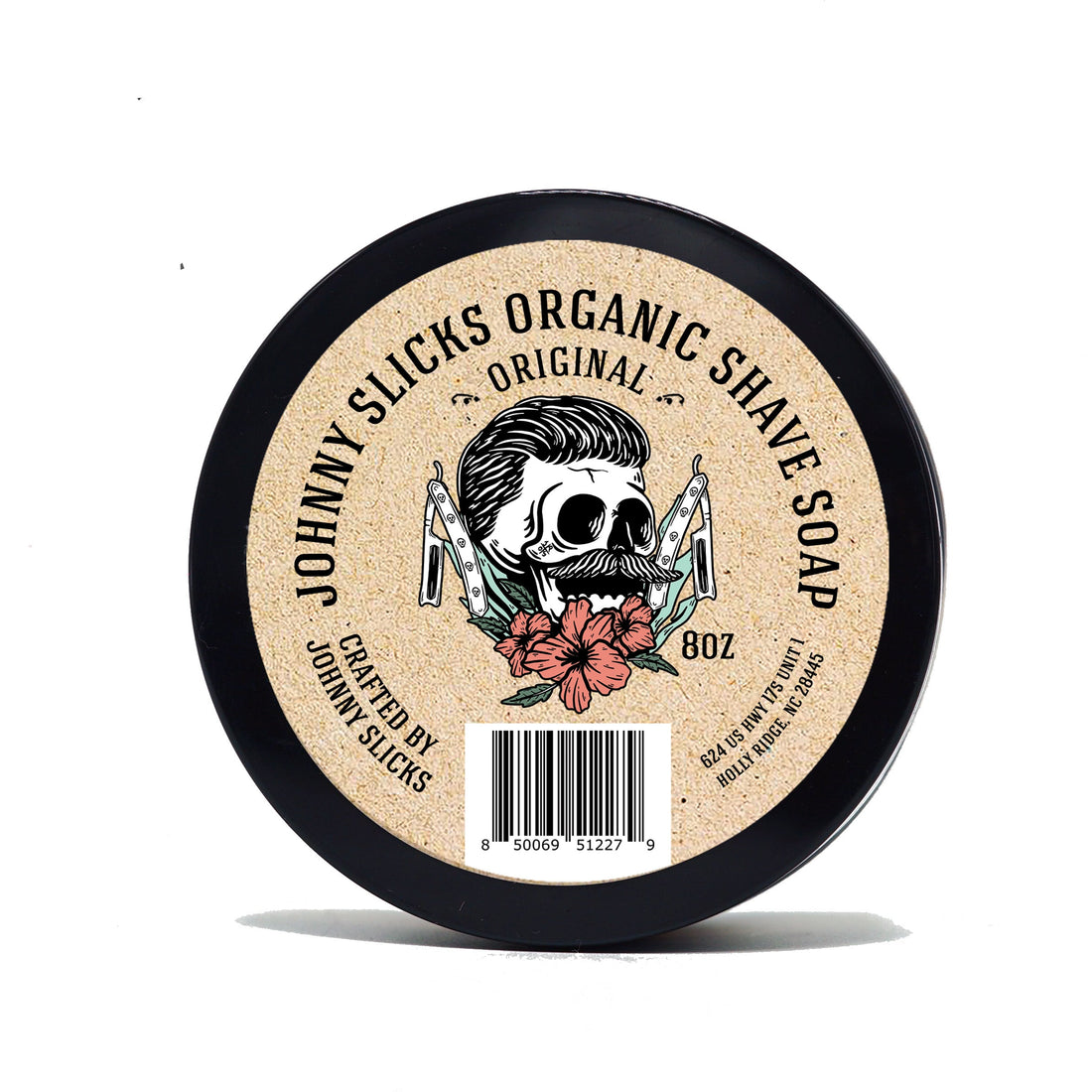 Round container of Johnny Slicks organic shaving soap with skull graphic