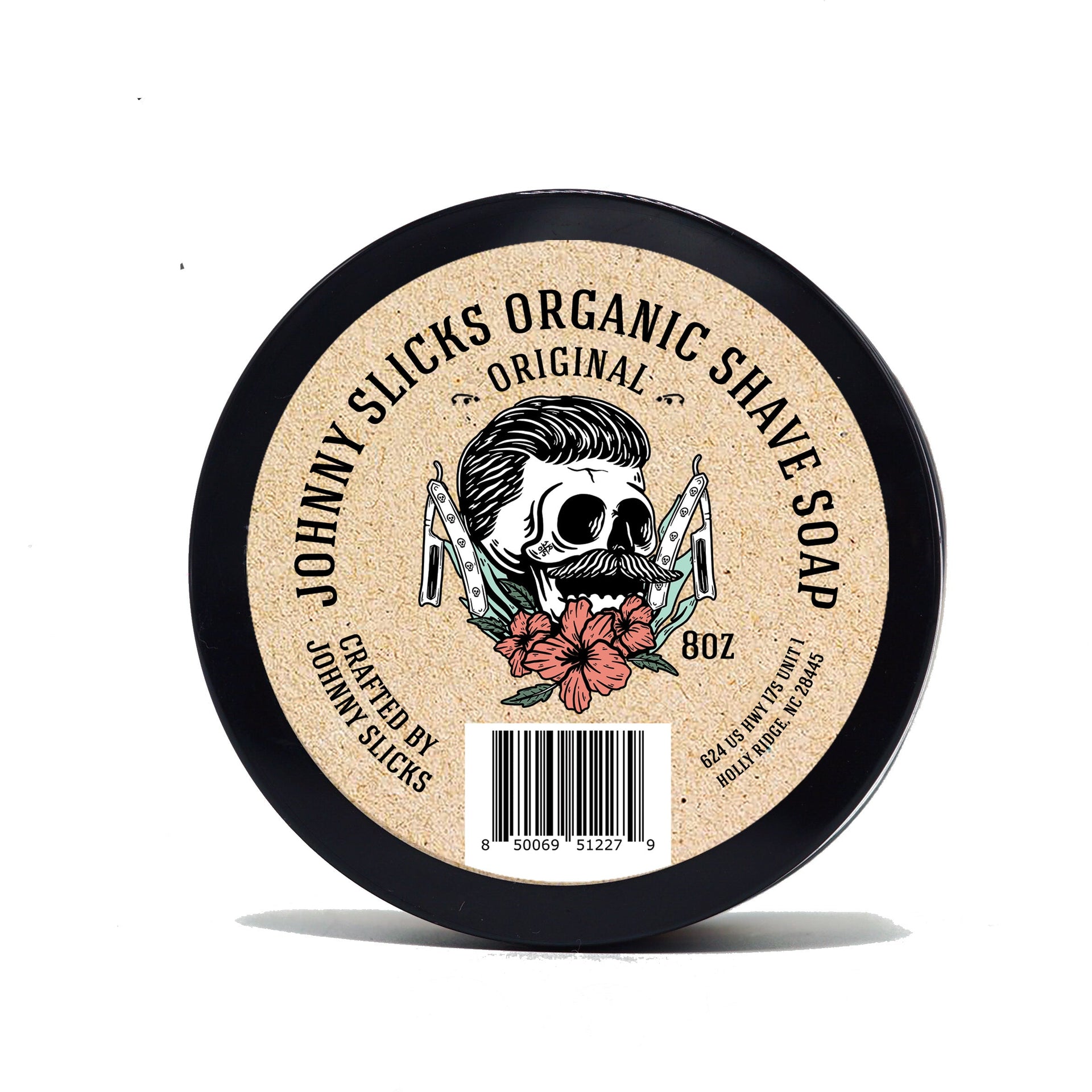 Round container of Johnny Slicks organic shaving soap with skull graphic