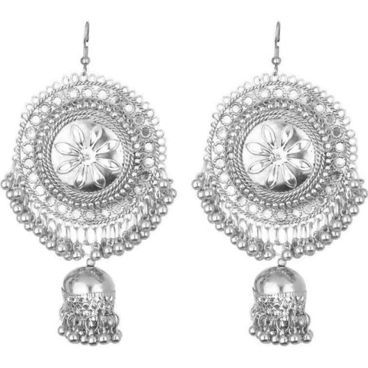 Close up of ethnic flower design Jhumka earrings with hanging silver pearls