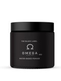 A black jar of Johnny Slicks Omega Water Based Pomade on a white background.
