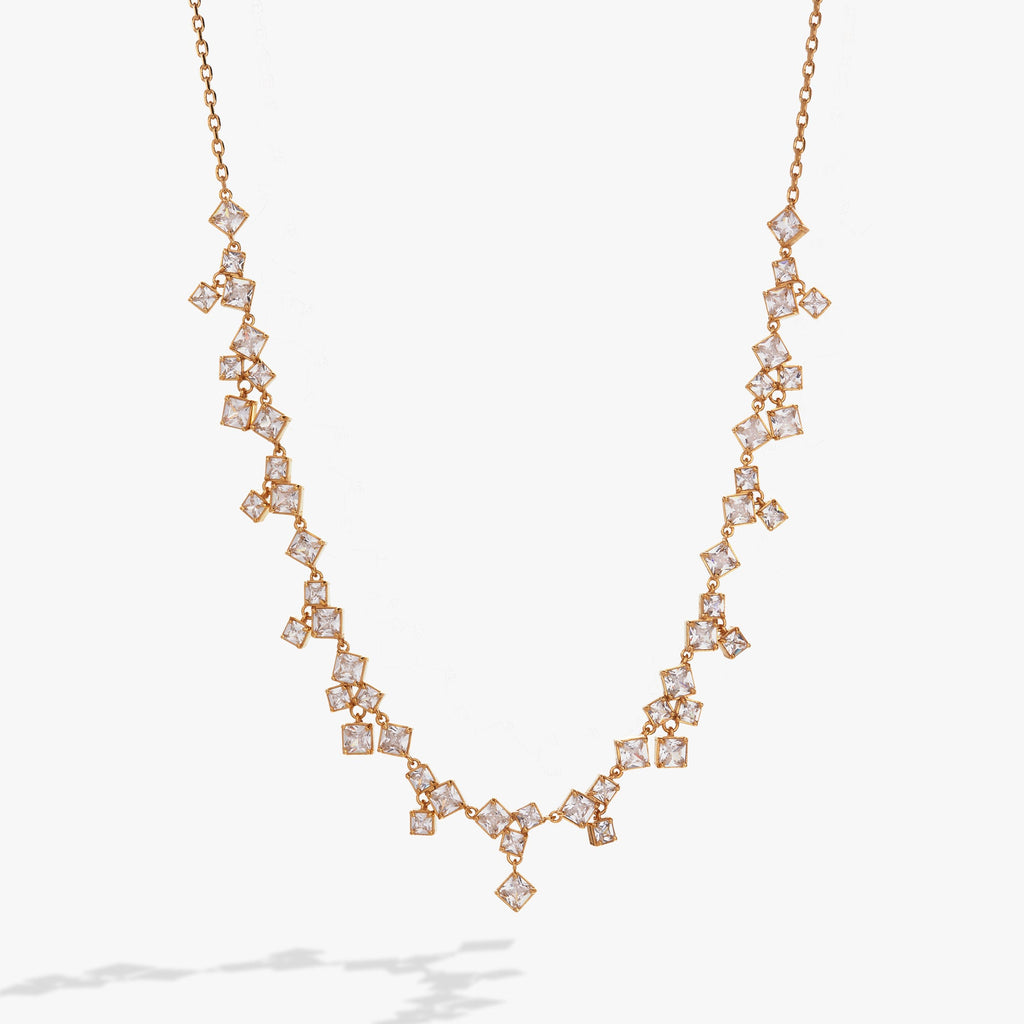 Crystal chandelier statement necklace featuring hanging crystal ice cube pendants.