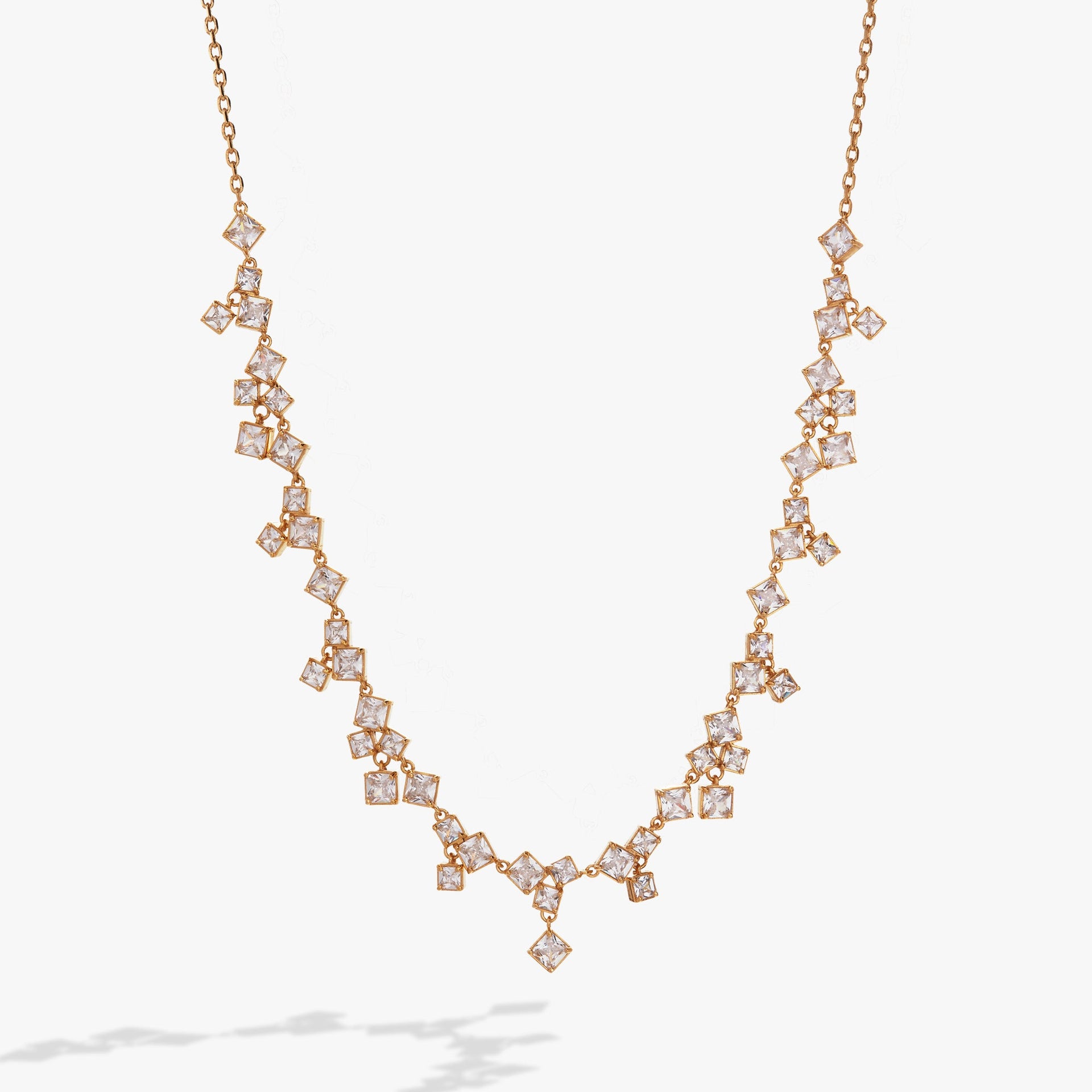 Crystal chandelier statement necklace featuring hanging crystal ice cube pendants.