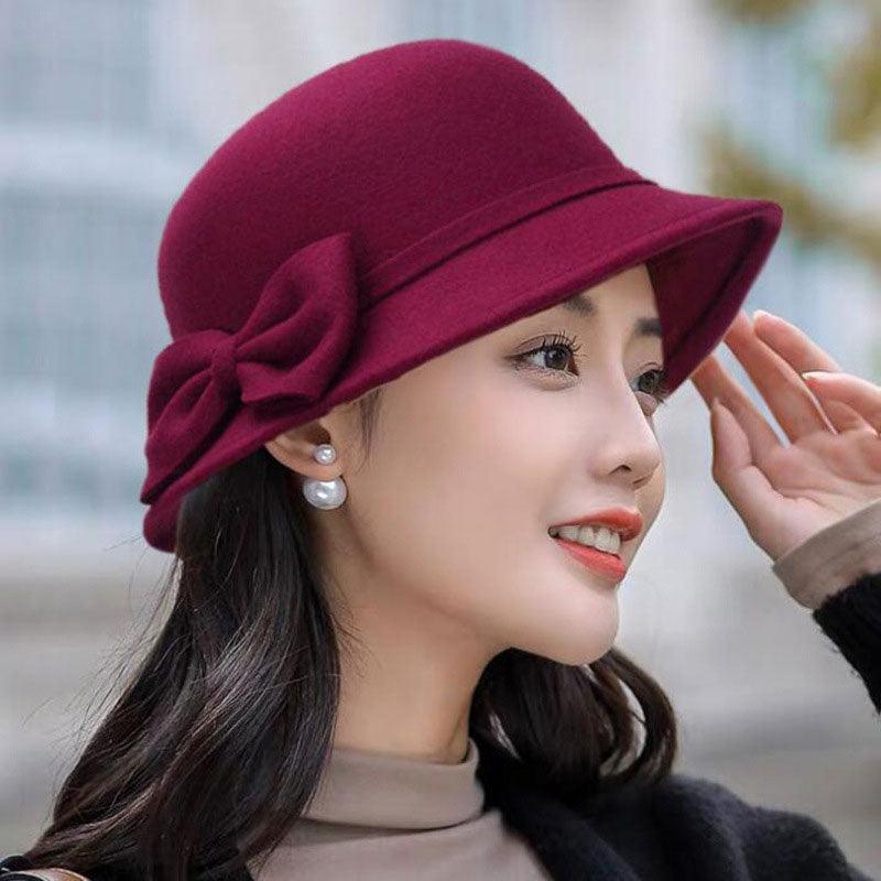 Elegant women's wide brim fedora hat with bow-knot detail in a soft woolen finish