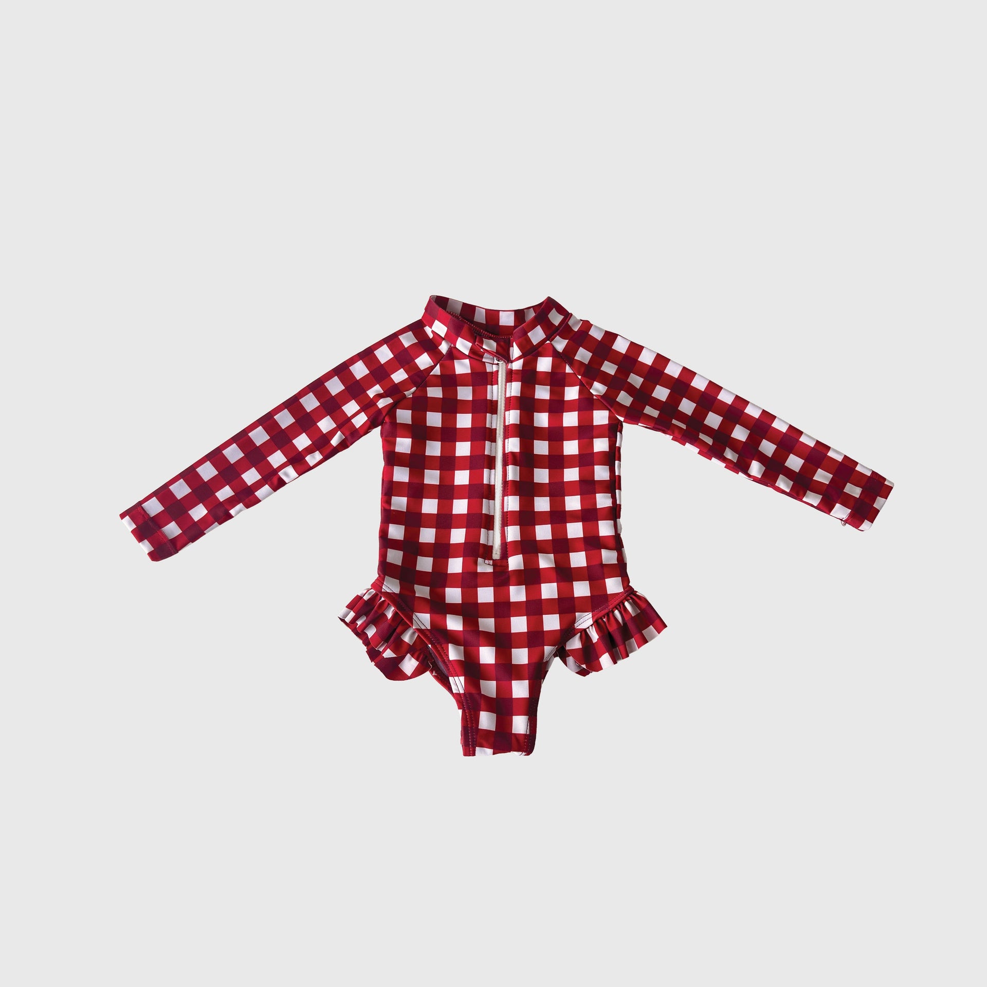 Girl's long-sleeve one-piece swimsuit in scarlet and white gingham plaid pattern with front zipper.