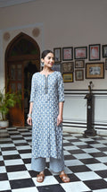 Women wearing a Grey Pure Muslin A-line kurta and plazo set with heavy digital print