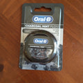 Charcoal-infused mint dental floss packaging for effective plaque removal