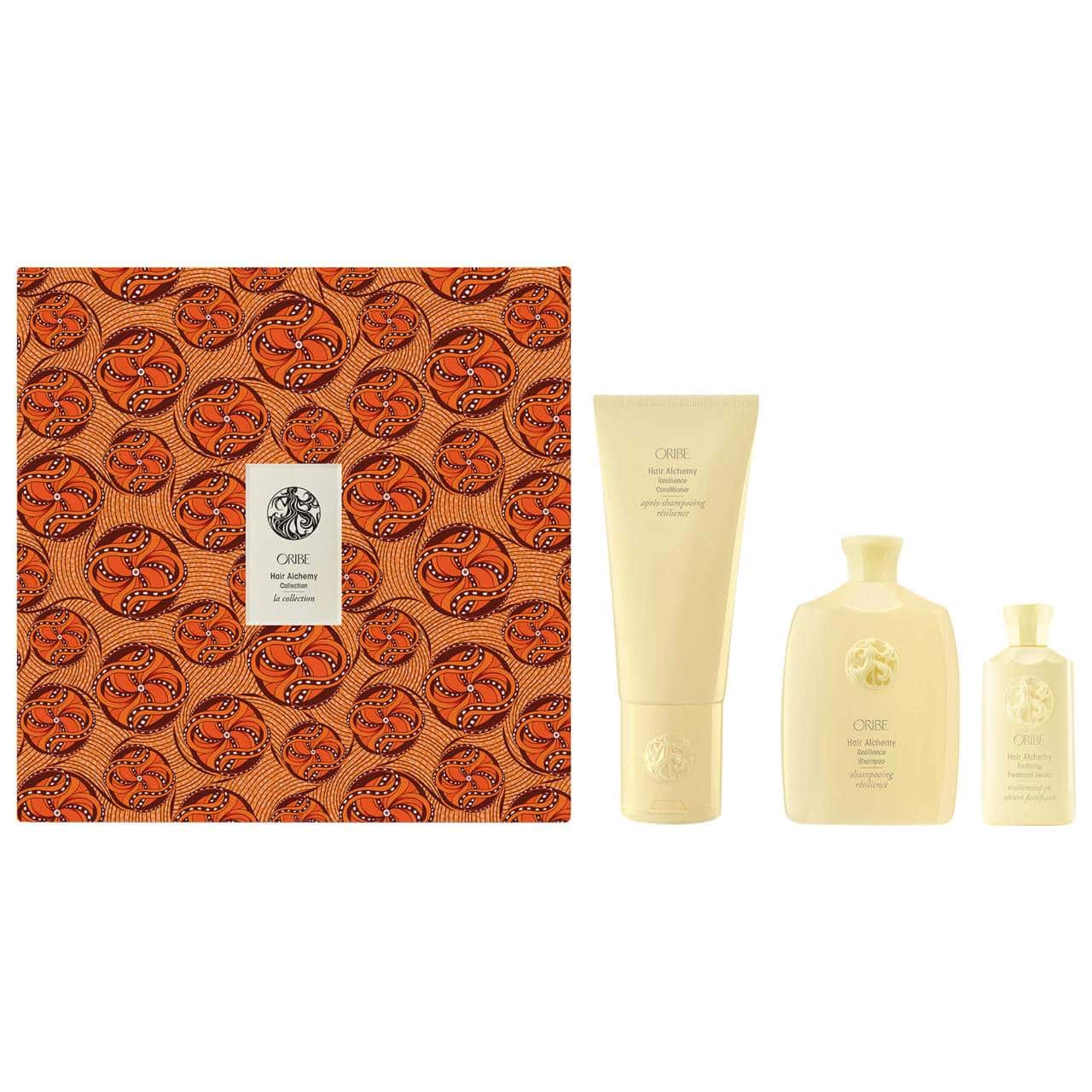 Oribe Hair Alchemy limited edition collection in orange and cream geometric packaging.