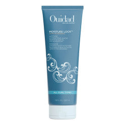 Ouidad Moisture Lock Ultra-Nourishing Intense Hydrating Mask in a muted slate blue tube with white ornate scroll graphics.
