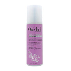 Bottle of Ouidad Coil Infusion Soft Stretch Priming Milk 10.5oz for curly hair