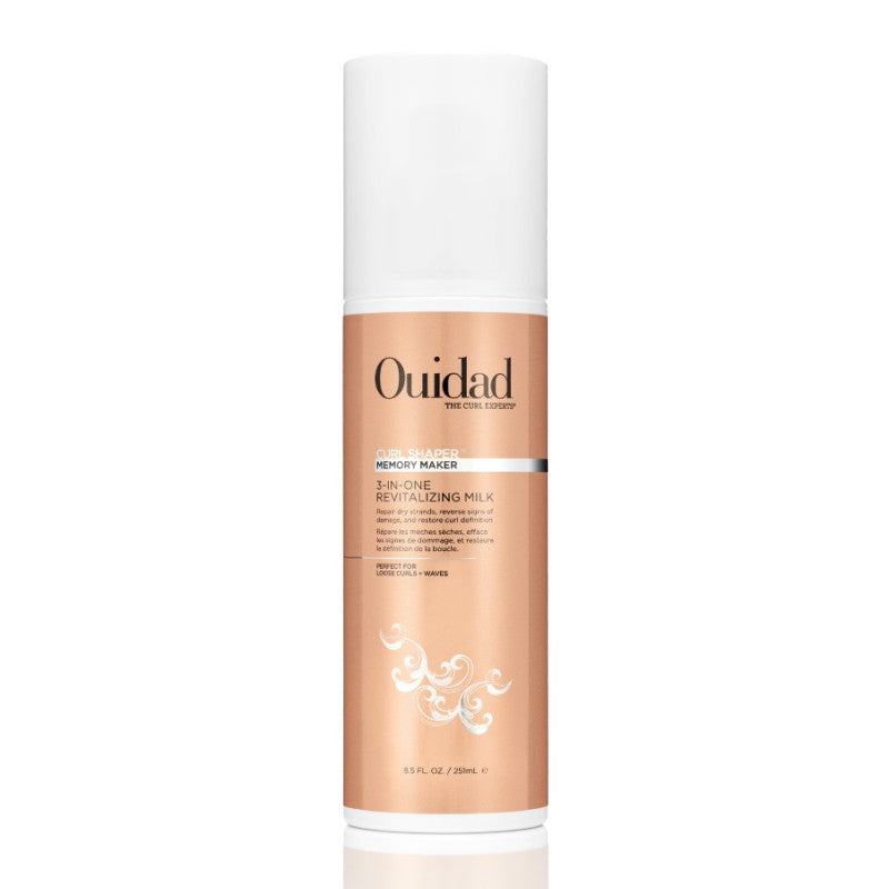 Ouidad Curl Shaper Memory Maker 3-in-1 Revitalizing Milk in a white and copper pump bottle.