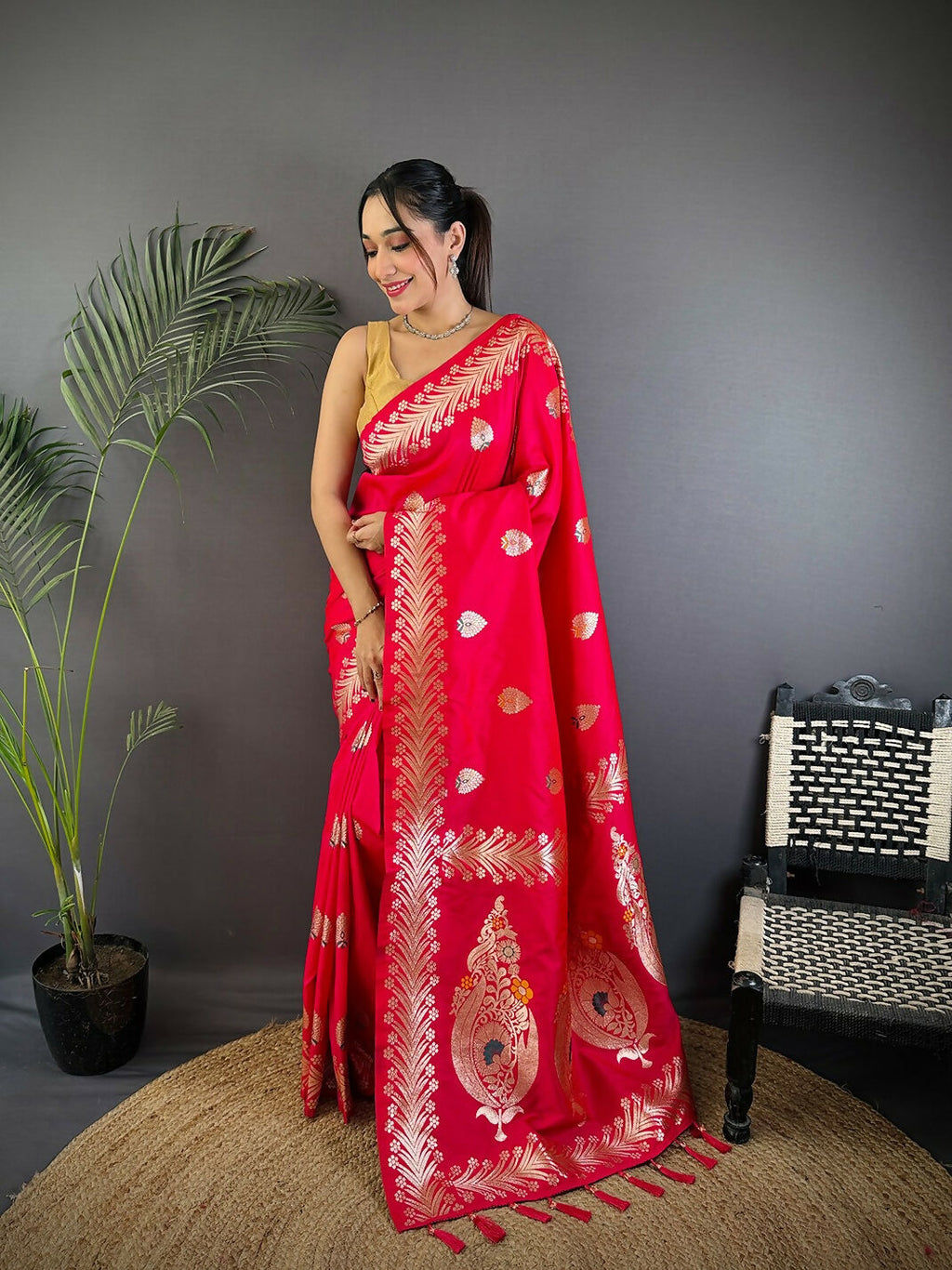 Pink Banarasi woven soft silk saree with traditional intricate detailing and matching blouse fabric.