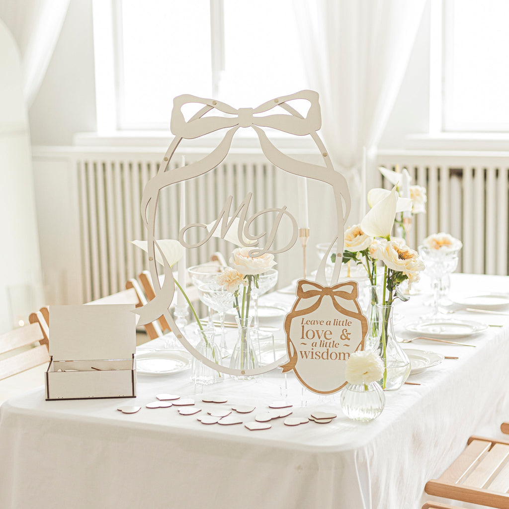 Minimalist oval guest book in natural wood and white, perfect for wedding guest signatures and home display.