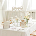 Minimalist oval guest book in natural wood and white, perfect for wedding guest signatures and home display.