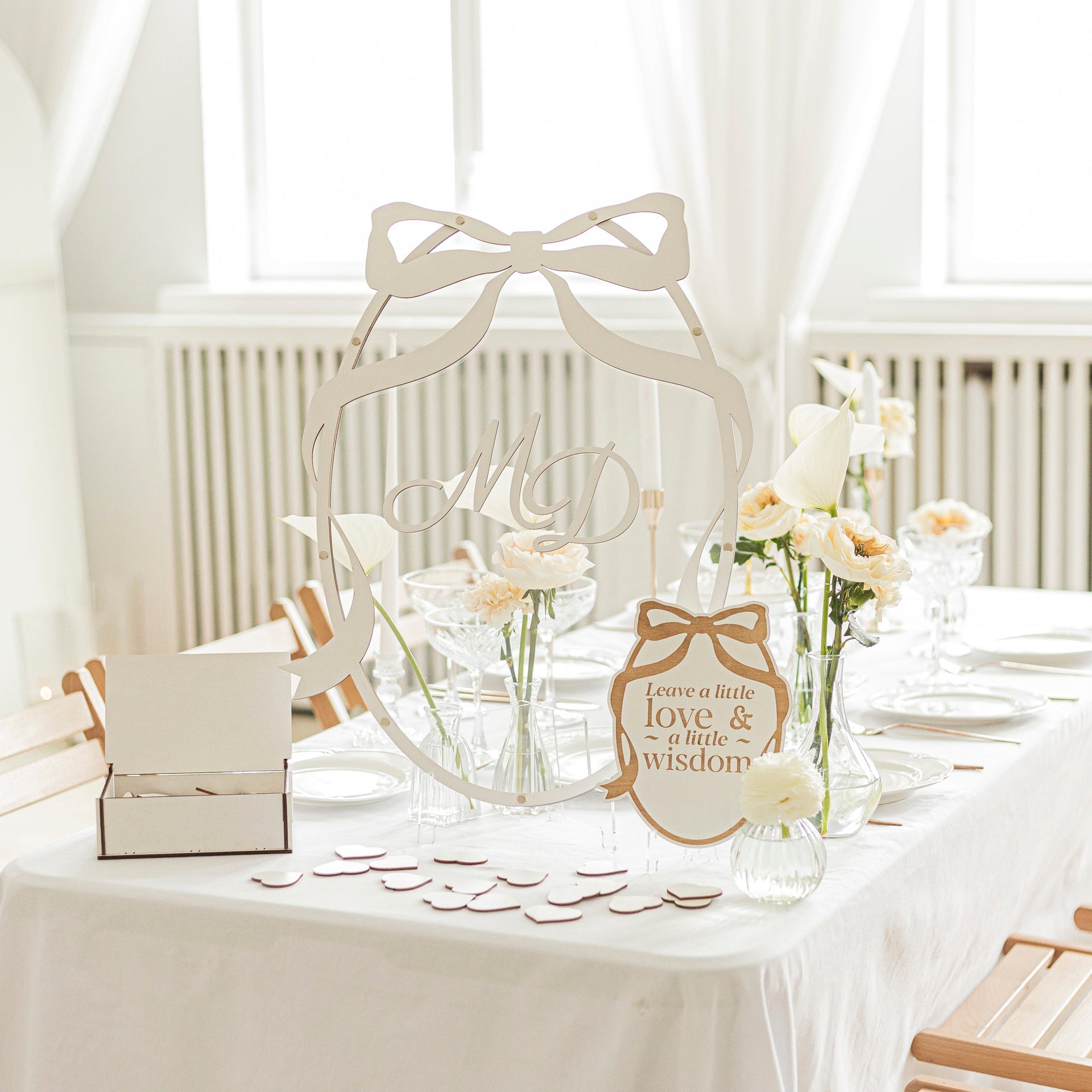 Minimalist oval guest book in natural wood and white, perfect for wedding guest signatures and home display.