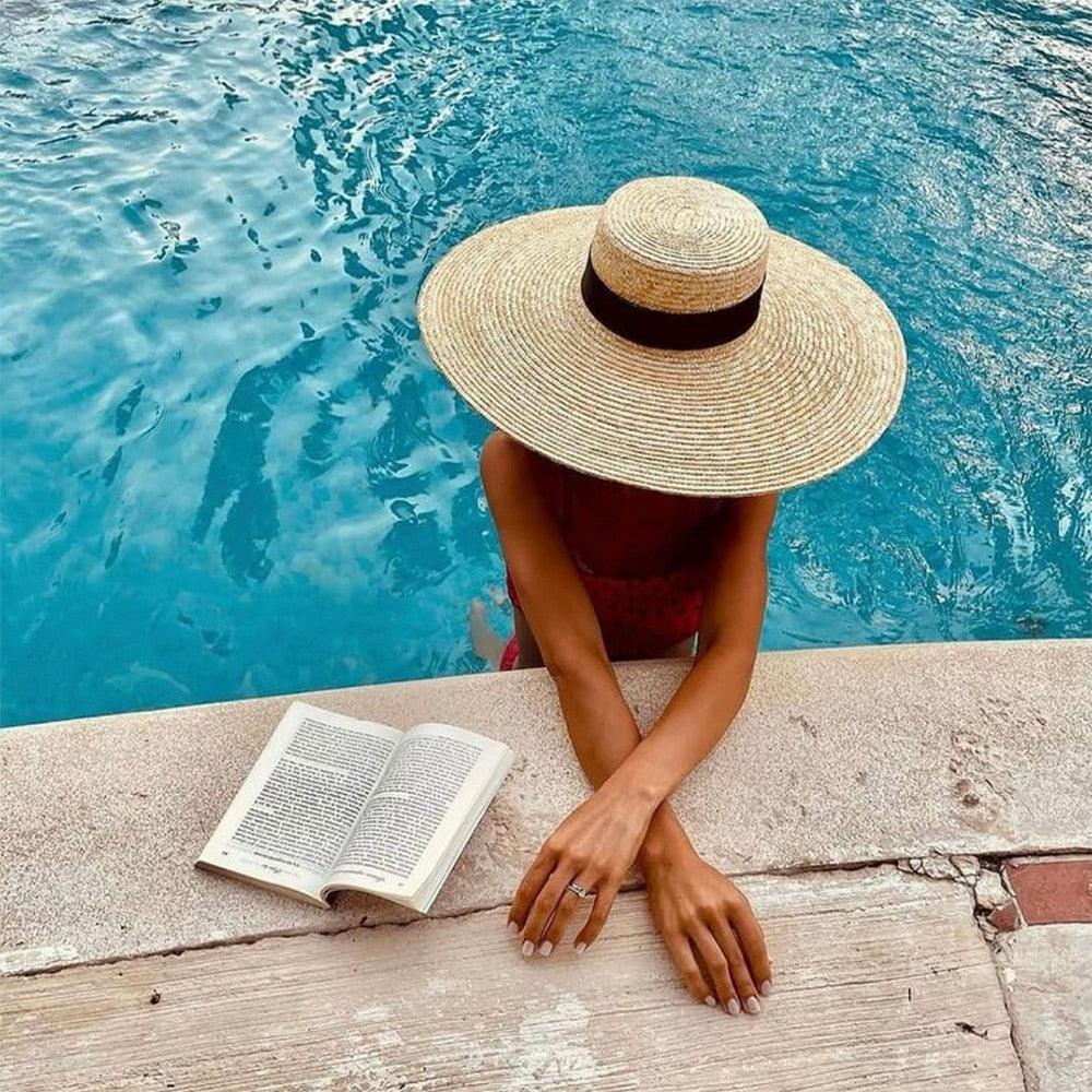 Oversized straw sun hat with a wide brim for beach and summer sun protection