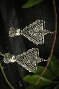 Modern silver-plated triangle drop earrings with oxidized detailing.