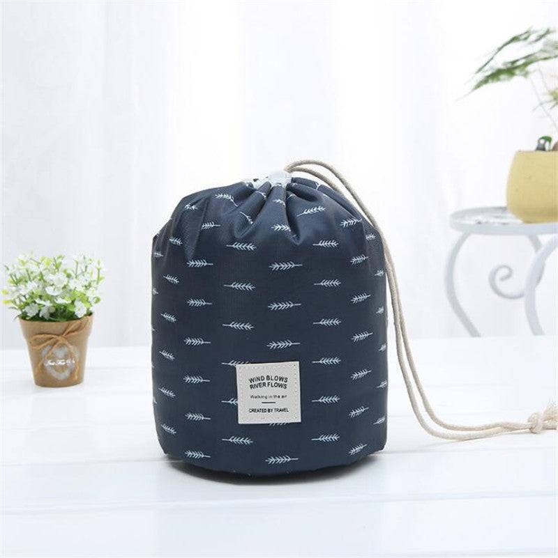 Set of three minimalist navy, grey, and pink waterproof polyester cosmetic bags for travel