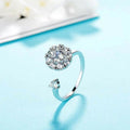Silver-tone brass adjustable ring worn on a finger, showcasing elegant polished finish.