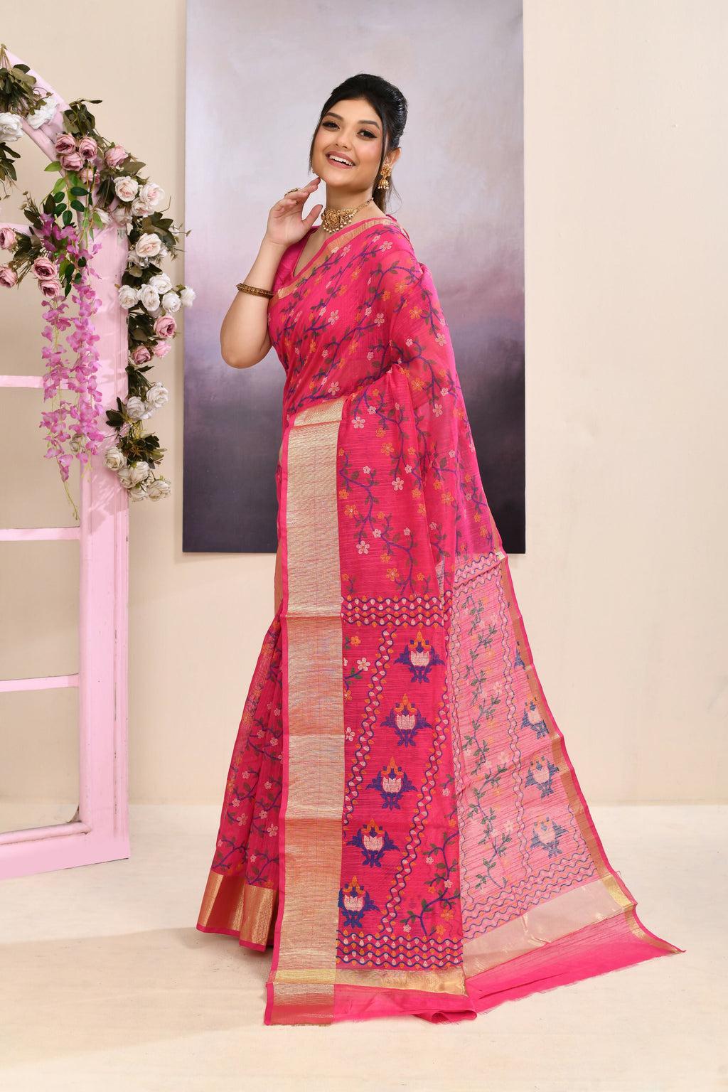 Vibrant pink printed cotton blend saree with embellishments