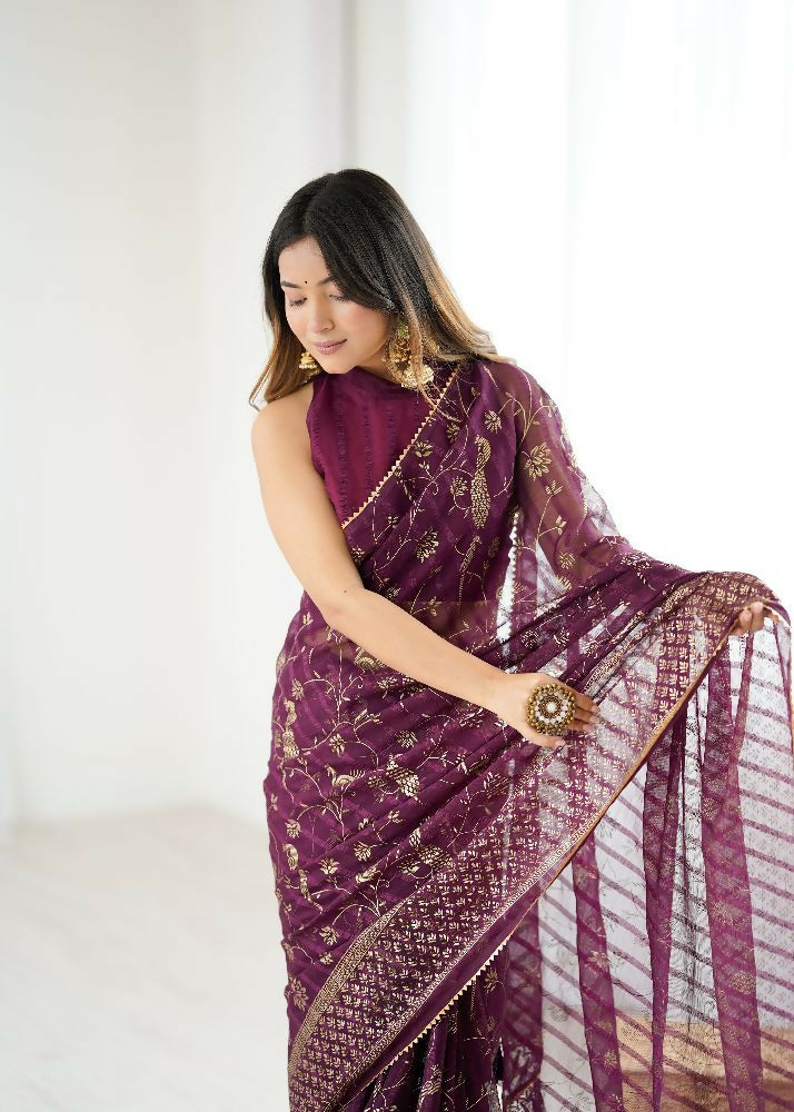 Wine-colored georgette saree with foil work and decorative zalar lace