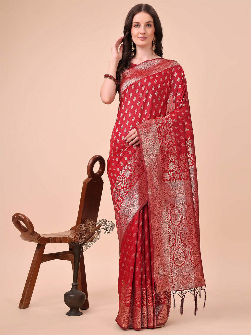 A beautiful red Lichi silk saree with a matching red blouse piece.