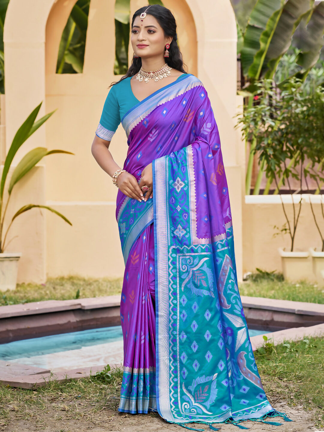 Elegant purple Pochampally silk saree with matching blouse piece draped beautifully