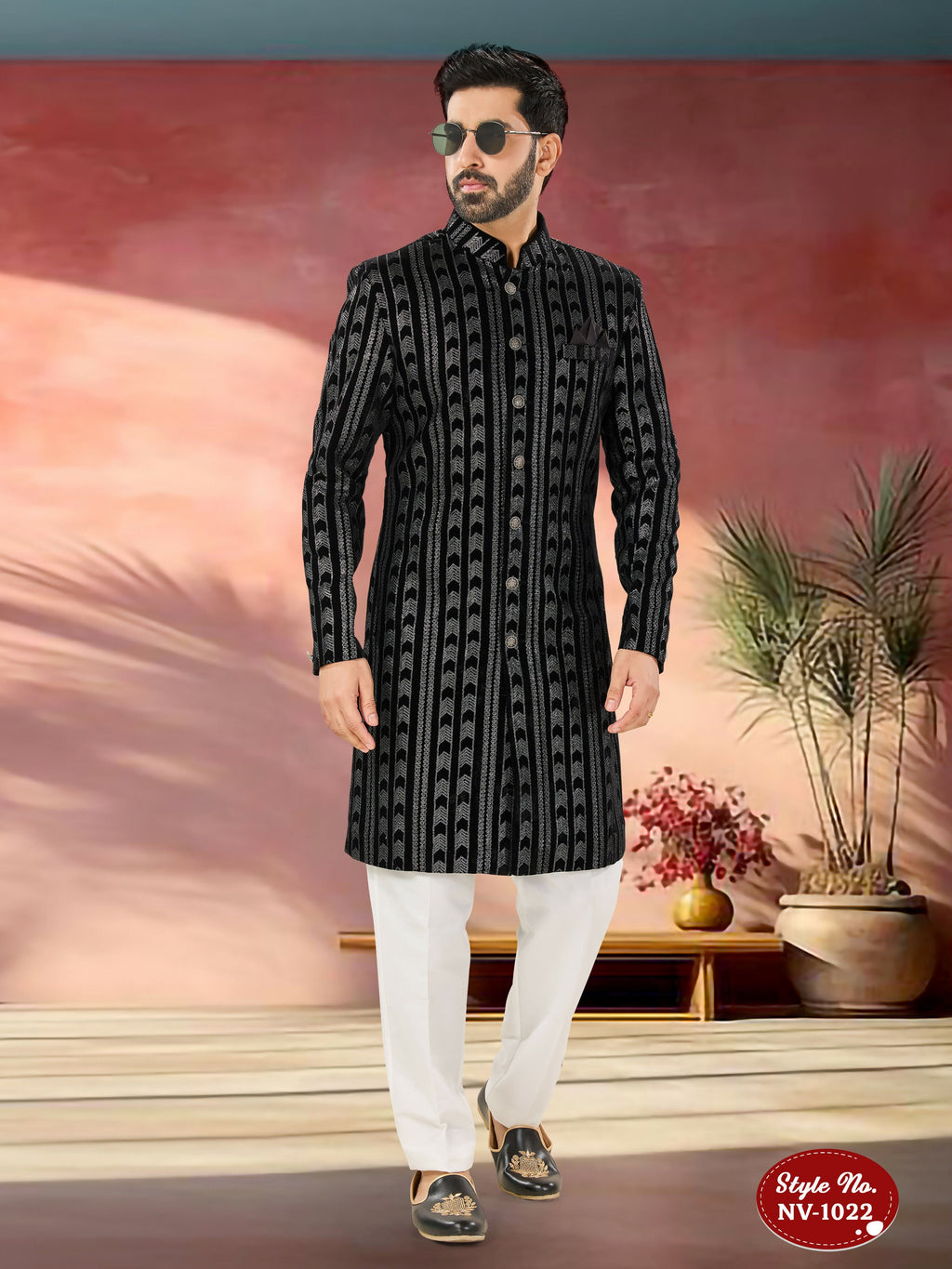 Men's black velvet Indo-Western kurta set with detailed thread and sequence embroidery.