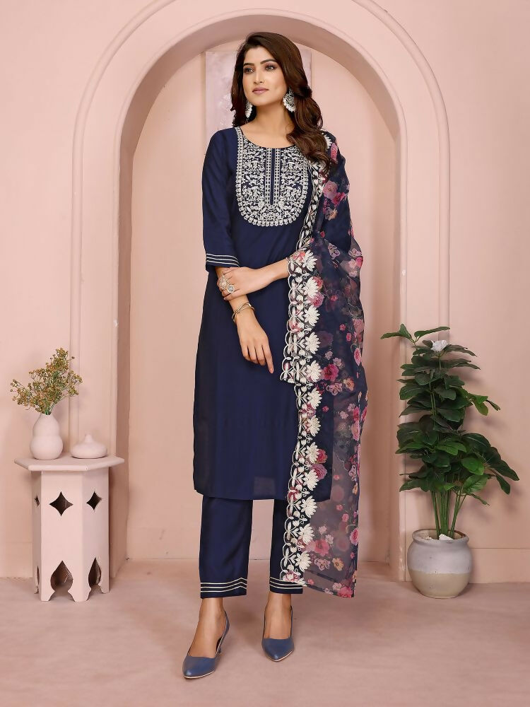 Women wearing a navy blue Roman fabric kurta set with intricate embroidery details