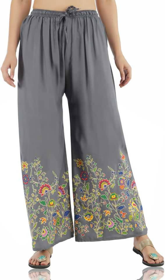 Grey palazzo pants featuring a delicate floral print