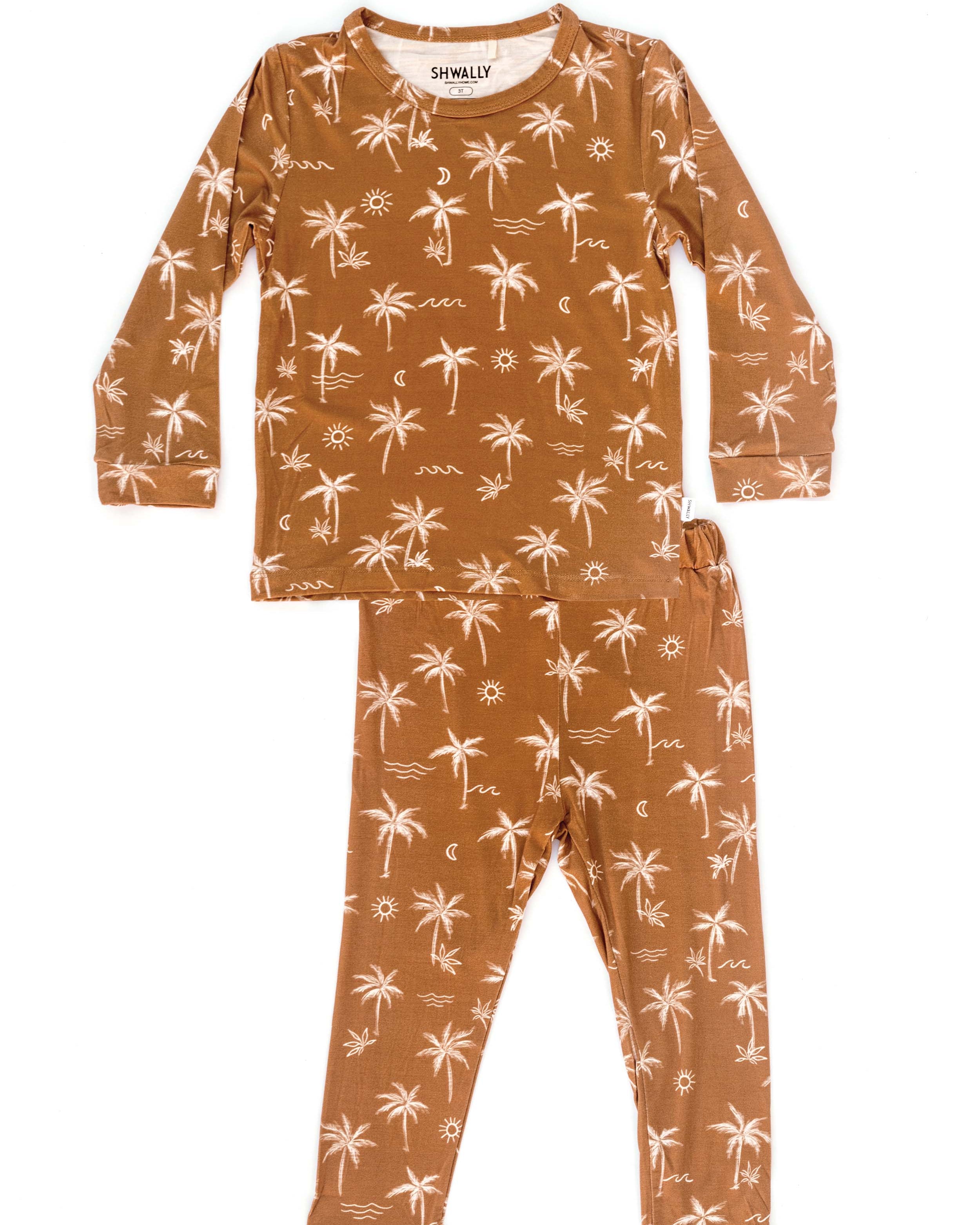 Children's pajama set with palm tree pattern on a white background