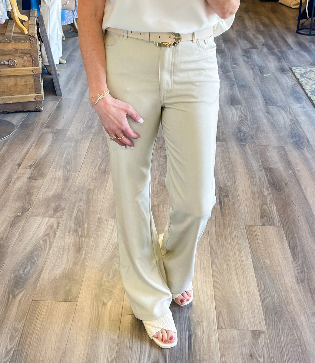 Aurora Pants in Sand shown from a front view, featuring a neutral tone and clean aesthetic