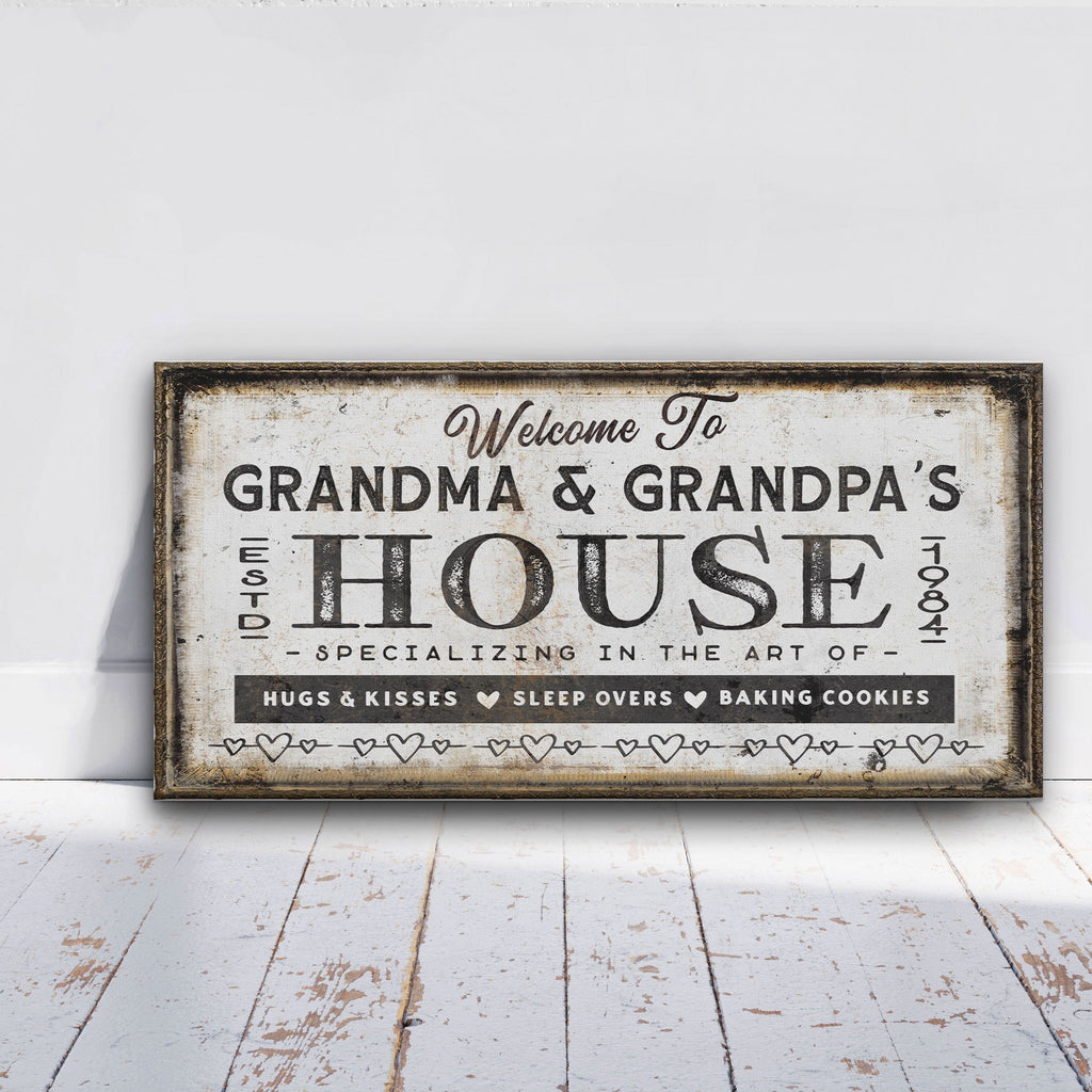 Personalized Grandma and Grandpa house canvas sign displayed on a wall with grandchildren's names