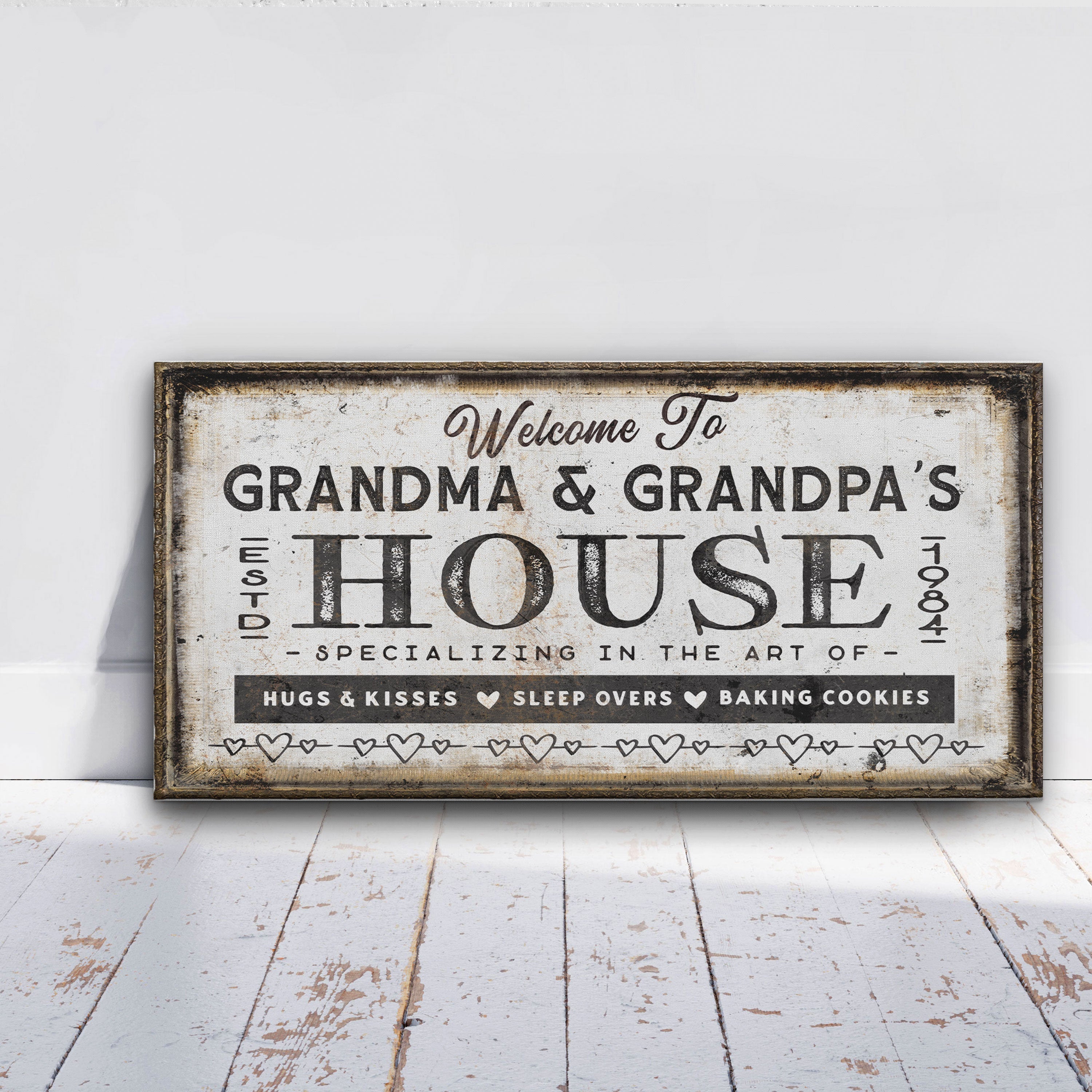 Personalized Grandma and Grandpa house canvas sign displayed on a wall with grandchildren's names