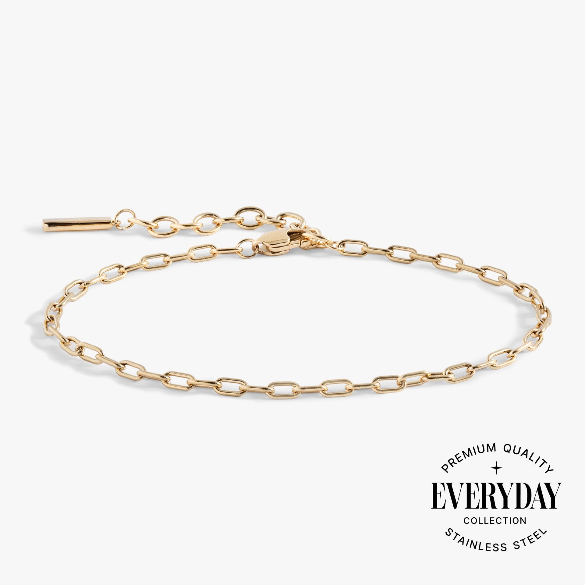 Close up of a polished paperclip chain bracelet on a wrist for stacking inspiration.