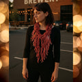 Handmade dropped stitch scarf in vibrant red, pink, and orange